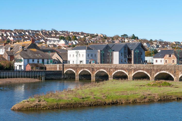 Wadebridge bridge with town and river.