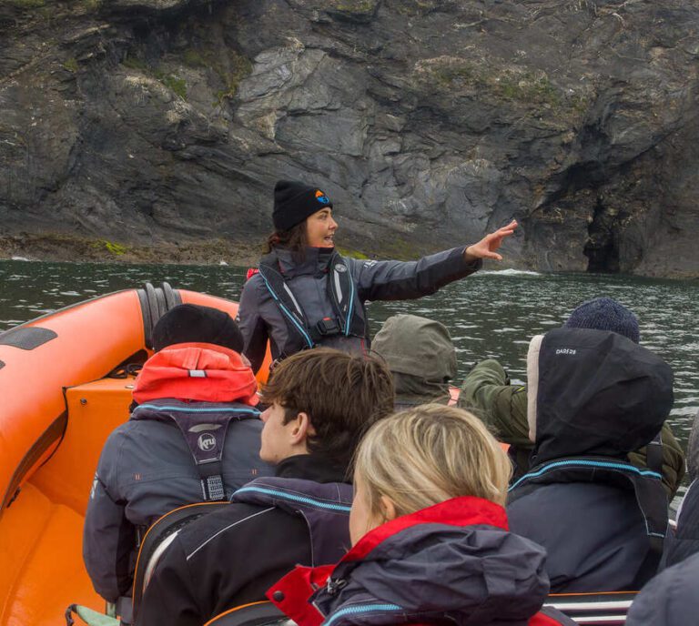 Guide giving information out on a cornwall boat trip